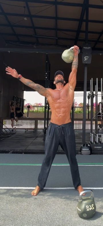 Benjamin training with a kettlebell while travelling
